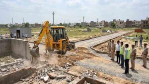 Bulldozers raze illegal colonies in Faridabad.